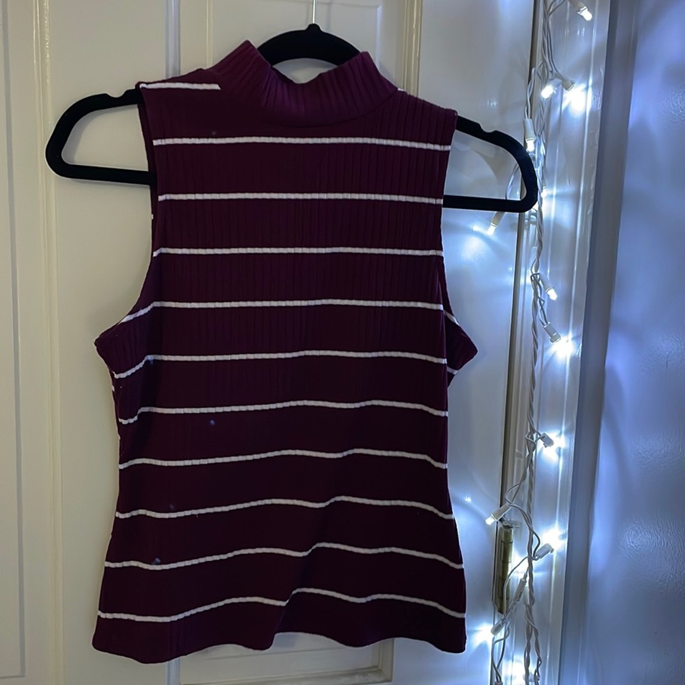 Maroon and white stripped sleeveless mock neck.